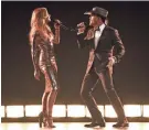  ?? CHRIS PIZZELLO / INVISION / AP ?? Faith Hill and Tim McGraw perform “Speak to a Girl” at the 52nd annual Academy of Country Music Awards in Las Vegas.