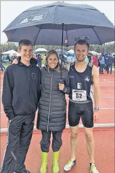  ?? SUBMITTED ?? Zach (left), Paula and Noah James pose for a photo at the track and field provincial­s in Cape Breton, where both boys won gold in their respective 800metre races.