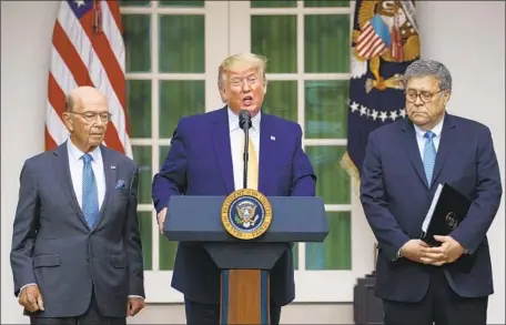  ?? Carolyn Kaster Associated Press ?? PRESIDENT TRUMP, with Commerce chief Wilbur Ross, left, and Atty. Gen. William Barr, blamed Democrats and “unfriendly” courts.