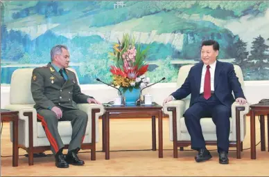  ?? LI GANG / XINHUA ?? President Xi Jinping meets with Russian Defense Minister Sergey Shoygu on Friday in the Great Hall of the People in Beijing.