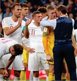  ?? EPA ?? Pain: Southgate consoles the England players in Russia