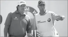  ?? CHARLES REX ARBOGAST, THE ASSOCIATED PRESS ?? Phil Mickelson, left, and his caddie Jim (Bones) Mackay have split after a quarter of a century together.