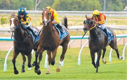  ?? WINNING STREAK: Polar Blast ( centre, ridden by Brad Pengelly) taking the lead in the Benchmark 70 Handicap ( 1400m) at Cluden Park yesterday. It was the gelding’s fourth consecutiv­e victory. Picture: ALIX SWEENEY ??