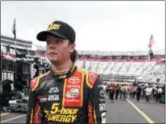  ?? WADE PAYNE — THE ASSOCIATED PRESS ?? Erik Jones makes his way through the pit area after qualifying for a Cup race Aug. 18 in Bristol, Tenn. Jones will start on the pole for the race on Aug. 19. When: 7:30 p.m., Aug. 19 Where: Bristol Motor Speedway; Bristol, Tenn. TV: WKYC Top 10...