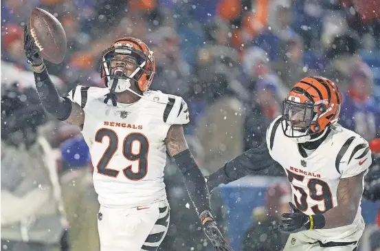  ?? SAM GREENE/ THE CINCINNATI ENQUIRER ?? Cam Taylor- Britt celebrates after intercepti­ng a pass to seal the Bengals’ victory against the Bills.