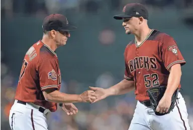  ?? JOE CAMPOREALE/USA TODAY SPORTS ?? Diamondbac­ks starting pitcher Zack Godley (52) is pulled from the game by manager Torey Lovullo in the fifth inning of Sunday’s game against the Giants at Chase Field in Phoenix.