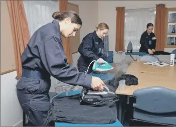  ?? Photo: Royal Navy ?? TRAINING
Recruits at Fareham pictured ironing their kit for the first time