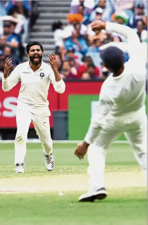  ??  ?? Ain’t that awesome: India’s Ravindra Jadeja (left) reacts after a dropped catch during play on day four of the third Test against Australia in Melbourne yesterday. — AP