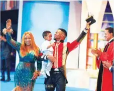  ??  ?? Gospel Music Sensation Joepraize celebrates with wife and son after winning the Hit Song Of the Year Category at the LIMA Awards 2019 with Pastor Chris Oyakhilome for his song “Joy Overflow”