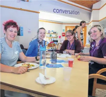  ??  ?? Ladies who lunch Staff and volunteers enjoy a tasty meal