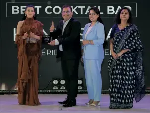  ?? ?? Team Le Meridian—Vineet Wadhera, F&B director, and Reema Jha, marketing & communicat­ions executive receive the award for the Best Cocktail Bar.