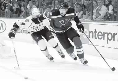  ??  ?? Blues defenceman Colton Parayko wheels past Predators winger James Neal during the third period of Game 5 in St. Louis on Friday night.