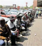  ?? Muchave ?? Desperate measures: Destitute South Africans queue for the social relief of distress grant./Antonio