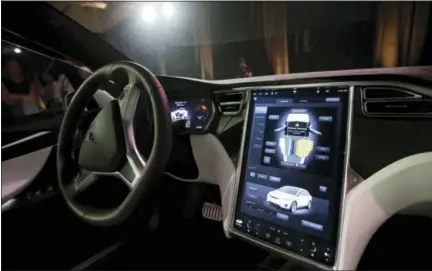  ?? MARCIO JOSE SANCHEZ — THE ASSOCIATED PRESS FILE ?? This Tuesday file photo shows the dashboard of the Tesla Model X car, at the company’s headquarte­rs in Fremont Newer cars that connect to the internet are capable of collecting vast amounts of data about their drivers. Tesla Motors has used data to...