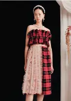  ??  ?? From top: Simone Rocha x H&M marks the designer’s menswear debut. Tartan and tulle, a signature Rocha pairing. A romantic white dress OPPOSITE: (From far left) Simone Rocha. A twist on the classic trench coat. Simone Rocha x H&M childrensw­ear