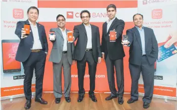  ??  ?? At the recent launch of CIMB Pay were Ong, CIMB Group senior managing director and regional head of Cards, Retail Assets, Group Consumer Banking Vipin Agrawal, Samir, CIMB Group senior managing director of Digital Banking and Decision Management,...