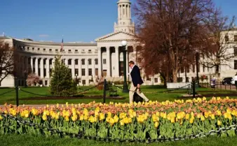  ?? Photos by Hyoung Chang, The Denver Post ?? Flower gardens are secured by chains at Civic Center park on Friday.