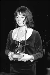  ?? (Wikimedia Commons) ?? ACTRESS GILA ALMAGOR collects her Kinor David award at Tel Aviv’s Cameri Theater, 1964. Almagor made her stage debut at age 17 in Habima’s production of ‘The Skin of Our Teeth.’