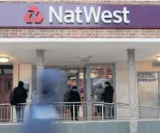  ??  ?? The logo of NatWest Bank, part of the Royal Bank of Scotland Group Plc is seen outside a branch in Enfield, London.