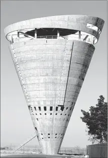  ?? Phaidon ?? THE CONICAL Grand Central Water Tower in Midrand, South Africa, built in 1996, does double duty as an urban sculpture.