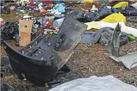  ?? ABIGAIL DOLLINS/STATESMAN-JOURNAL VIA AP ?? Debris is strewn in the area after a vehicle crashed into a homeless camp, killing several people Sunday in Salem, Ore.