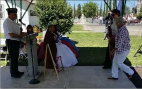  ?? RECORDER PHOTOS BY CHARLES WHISNAND ?? Karen Herrera and Honey Chapman of the American Legion Post Auxiliary Unit 20 present the Memorial Cross at Monday’s observance.