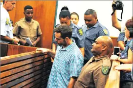  ?? Picture: AYANDA NDAMANE ?? ‘FLIGHT RISK’: Jacobus Oosthuizen made his first appearance in the Paarl Magistrate’s Court on a charge of killing his pregnant girlfriend, Nicola Pienaar.