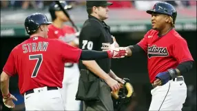  ?? TONY DEJAK — THE ASSOCIATED PRESS ?? Jose Ramirez and Myles Straw celebrate after scoring in the first inning against the Brewers on Sept. 10.