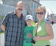  ?? LAURA JEAN GRANT/CAPE BRETON POST ?? Allan and Sherry MacPherson, and their grandson Koby Jeffrey, were among many who visited the Fortress of Louisbourg during its annual Culture Fête celebratio­ns.