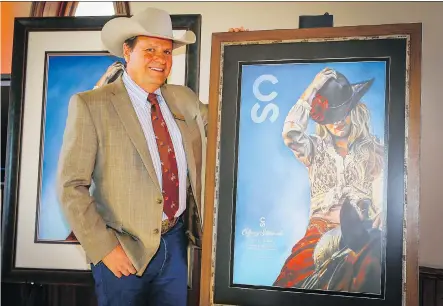  ?? PHOTOS: AL CHAREST ?? Calgary Stampede president Dana Peers unveiled the 2019 Calgary Stampede poster created by Rebecca Shuttlewor­th.