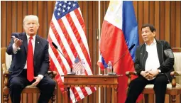  ??  ?? US President Donald Trump gestures beside Philippine­s President Rodrigo Duterte as they hold a bilateral meeting on the sidelines of the 31st Associatio­n of Southeast Asian Nations (ASEAN) Summit and Related Meetings at the Philippine Internatio­nal...
