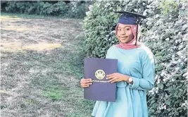  ??  ?? Fatou Secka dressed up and posed for a photo with her master's degree from Dalhousie University after receiving it in the mail. The internatio­nal graduate in Halifax has struggled to find work in her field of study, engineerin­g, since her graduation in May.