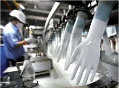  ??  ?? Top Glove’s earnings are expected to be anchored by capacity-led expansions, with some analysts forecastin­g an eight to 10 per cent capacity growth for FY19. — Reuters photo