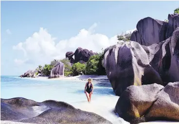  ?? — STEVE MACNAULL ?? Anse Source D’Argent in the Seychelles is considered the best beach in the world for its white sand, emerald water, granite boulders and palm trees.