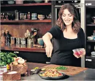  ??  ?? Food for thought: Nigella Lawson in her kitchen, or is it a studio?