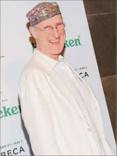  ?? Jason Kempin / Getty Images ?? James Cromwell glued his hand to the counter of a Manhattan Starbucks Tuesday to protest the coffee chain’s extra charge for plant-based milk.