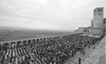  ?? GREGORIO BORGIA/THE ASSOCIATED PRESS ?? Pope Francis leads a mass in front of St. Francis Basilica in Assisi, Italy, on Friday.