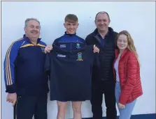  ??  ?? Carnew’s Ken Redmond, under-17 captain John Doyle, John Naylor, who sponsored a new set of training tops, and Sophie Naylor.