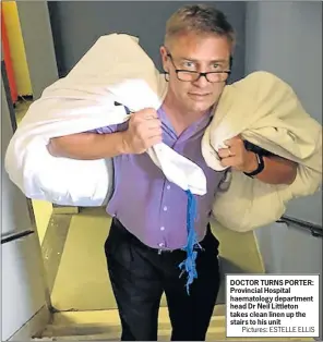  ?? Pictures: ESTELLE ELLIS ?? DOCTOR TURNS PORTER: Provincial Hospital haematolog­y department head Dr Neil Littleton takes clean linen up the stairs to his unit