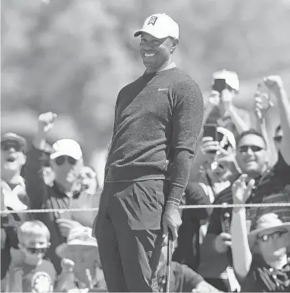  ?? MIKE EHRMANN/GETTY ?? birdie putt on the seventh hole during the first round of the 2018 Arnold Palmer Invitation­al. Woods is expected to once