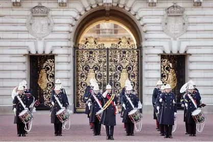  ?? Reuters ?? Members of the Royal Navy marching band perform during the Changing of the Guard outside Buckingham Palace in London on Sunday.