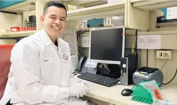  ?? RICARDO RAMIREZ BUXEDA/STAFF PHOTOGRAPH­ER ?? Kevin Mora has worked at the ORMC medical lab since last summer while he was wrapping up his senior year at UCF.