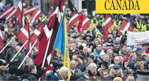  ?? ILMARS ZNOTINS/AFP/GETTY IMAGES/FILES ?? Veterans of the Latvian Legion, a force that was commanded by the German Nazi Waffen-ss during the Second World War, walk to the Monument of Freedom in Riga, Latvia, in March 2016 to commemorat­e a 1944 battle in their ultimately failed attempt to stem...