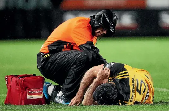  ?? PHOTO: PHOTOSPORT ?? Hurricanes back Nehe Milner-skudder receives treatment during their Super Rugby game against the Chiefs last weekend.