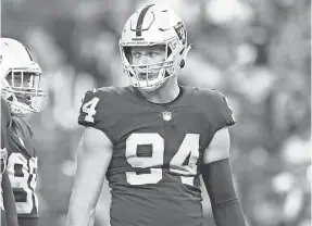  ?? MARK J. REBILAS/ USA TODAY SPORTS ?? Raiders defensive end Carl Nassib forced a key fumble in overtime Monday.