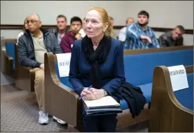  ?? NWA Democrat-Gazette/CHARLIE KAIJO ?? Laura Gordon, Spanish interprete­r, waits for her clients to arrive Nov. 16 at the Benton County Courthouse Annex in Bentonvill­e. Interprete­rs must be certified for court proceeding­s.