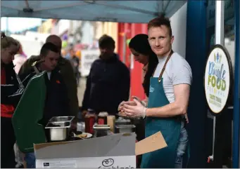  ??  ?? Jack O’Sullivan on duty at the Dingle GAA stand where beef burgers were being served at a hectic rate outside Paul Geaney’s bar during the Dingle Food Festival. All photos by Declan Malone.