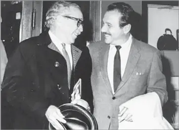  ??  ?? PART OF THE ‘SPARTACUS’ TEAM Edward Lewis, right, with screenwrit­er Dalton Trumbo in 1967. Trumbo was one of the Hollywood Ten.