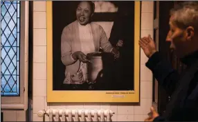  ?? (AP/Yohan Bonnet) ?? Brian Bouillon-Baker shows a picture of his mother, Josephine Baker, displayed in her former house, the Chateau des Milandes, in Castelnaud-la-Chapelle, France, on Nov. 11.