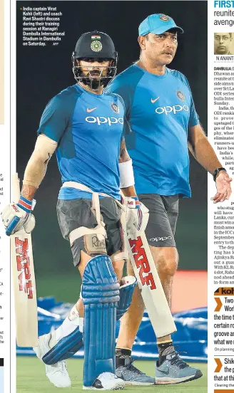  ?? AFP ?? India captain Virat Kohli (left) and coach Ravi Shastri discuss during their training session at Ranagiri Dambulla Internatio­nal Stadium in Dambulla on Saturday.